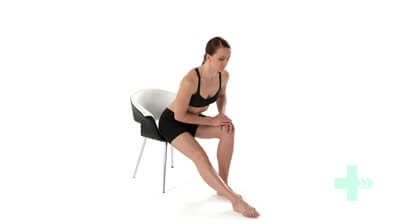 Woman on chair stretching her hamstring